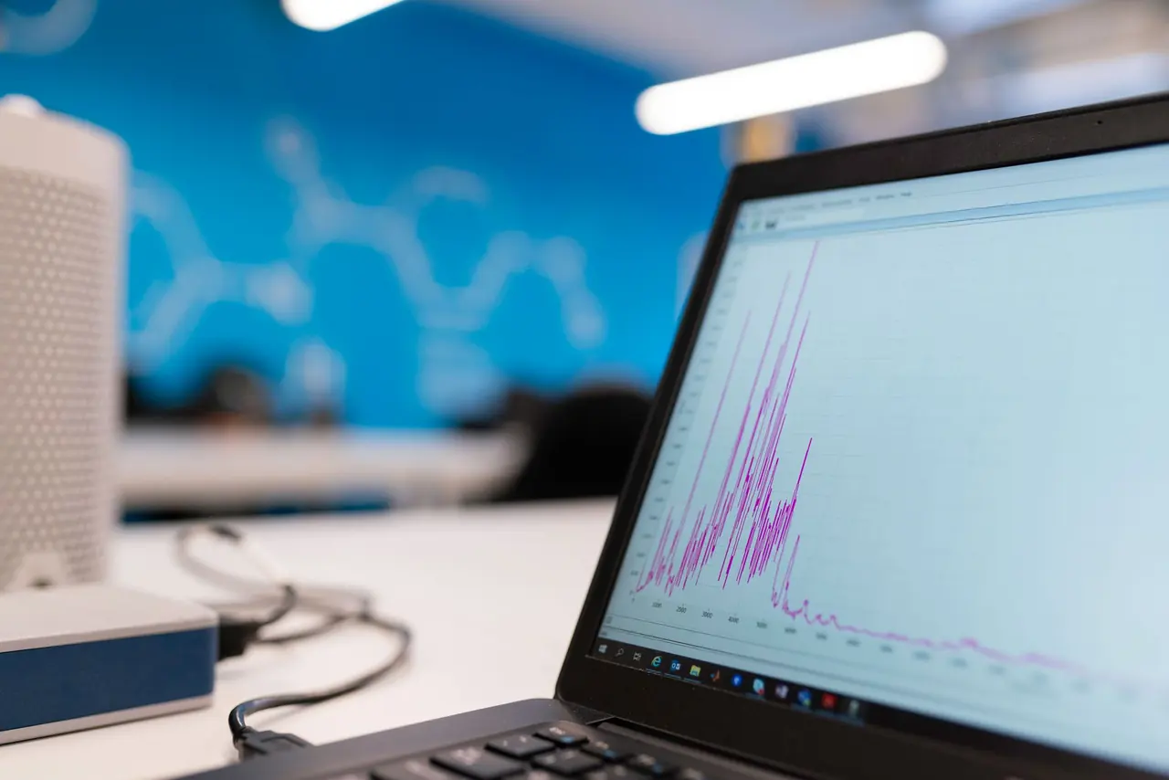 A laptop showing a line graph of website data